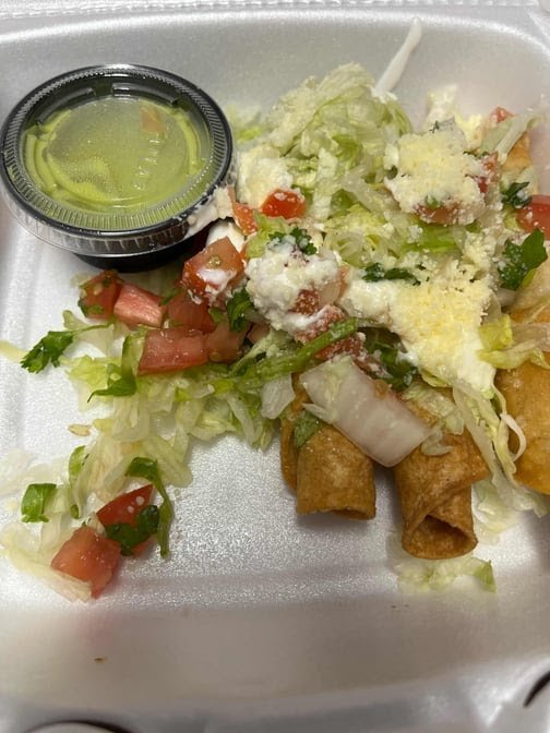 Close-up of tacos with fresh toppings.