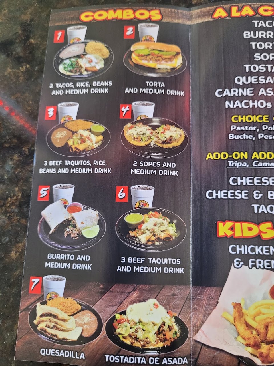Printed menu with tacos and soups.