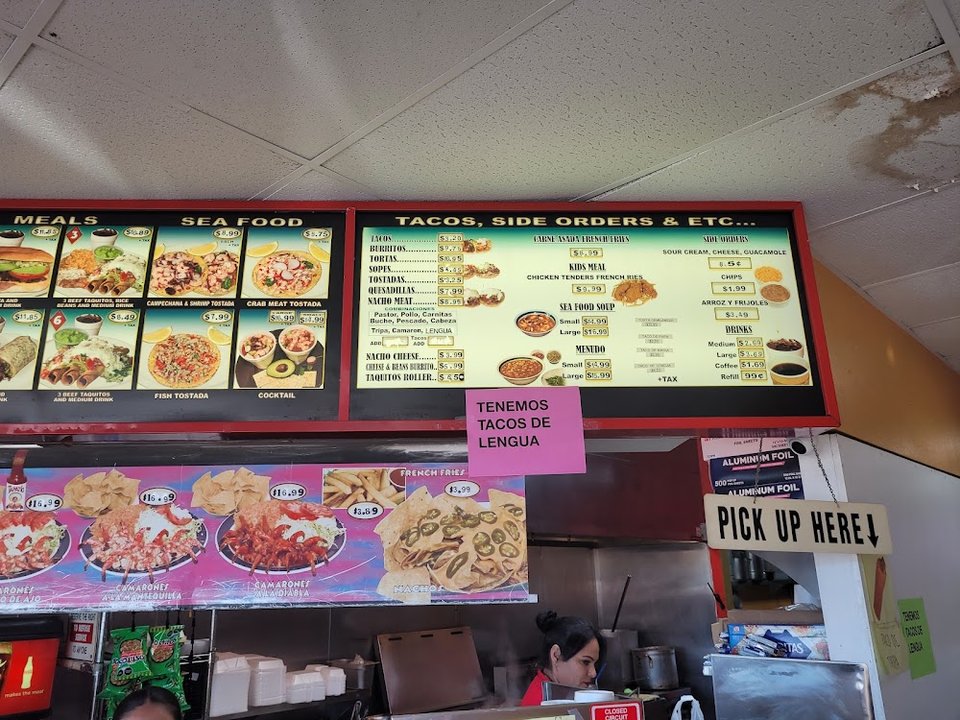 Menu board showing combo meals and drinks.